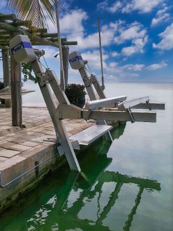 IMM Quality walkboard and platinum elevator boat lift at waterfront home