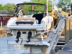 kitzen alumavator elevator boat lifts with highspeed boat mounted to dock